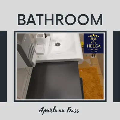 a picture of a bathroom with a white sink at HELGA apartmani BOSS i PRESIDENT in Kraljevo
