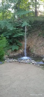a waterfall in the middle of a river with rocks at Apartman '' PETICA'' in Vrnjačka Banja