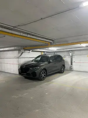 a black car parked in a parking garage at Leo Lux 2 in Niš