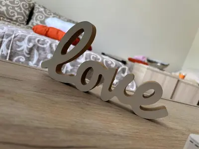 a metal sign that says exit on a wooden floor at Apartman i Studio Nikolas in Soko Banja