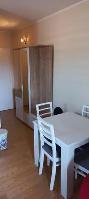 a white table and chairs in a room at Studio Isidora in Vrnjačka Banja