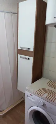 a washer and dryer in a small room at Studio Isidora in Vrnjačka Banja