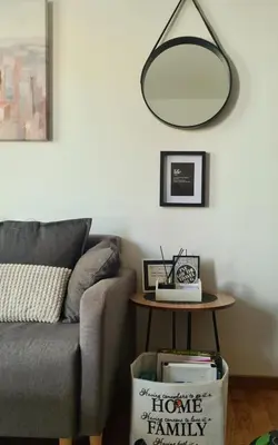 a living room with a couch and a table at Iskra Sparkle apartman in Soko Banja