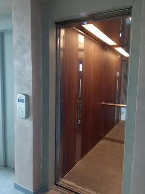 a sliding glass door in a hallway with a light at Apartman Zara - free private parking - in Jagodina