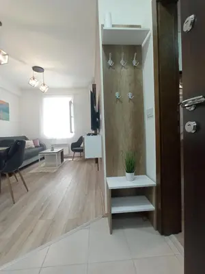 a living room with a couch and a table at Apartman Zara - free private parking - in Jagodina