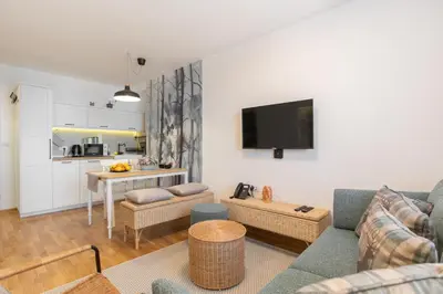 a living room with a couch and a table at Cardak u Sumi (Forest house) in Kopaonik