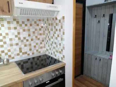 a kitchen with a sink and a stove at Panorama in Vrnjačka Banja