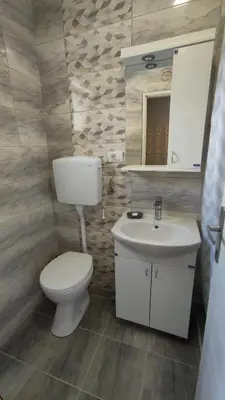 a bathroom with a toilet and a sink at Apartman 2 Miljković in Soko Banja