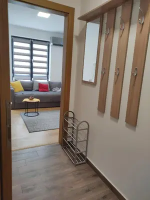 a hallway leading to a living room with a couch at Mali Raj in Soko Banja