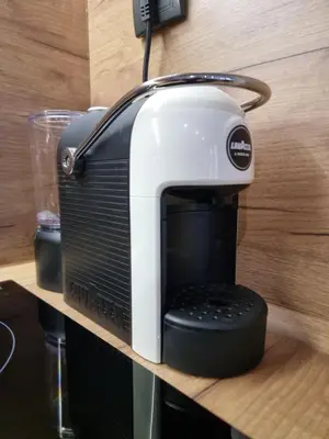 a black and white toaster sitting on a shelf at Apartman 