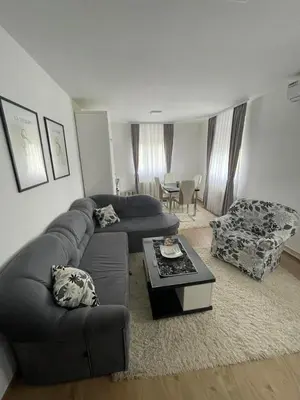 a living room with a couch and a table at TRG In in Vrnjačka Banja