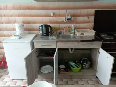 a small kitchen with a sink and a counter at Apartman Miki Jovanović in Pirot