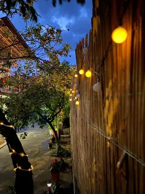 a row of lights on a wall with a sidewalk at Apartman TADIJA Niš in Donja Vrežina