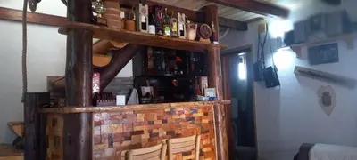 a bar in a room with a brick wall at Vila Golija in Raška