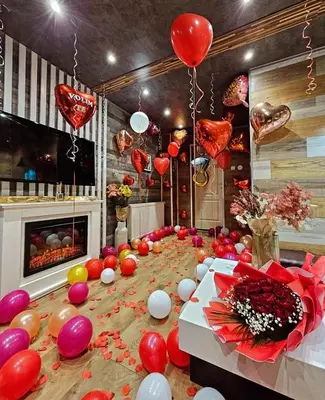 a long table with balloons and hearts on it at Apartman OGLEDALO in Zaječar