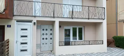 a balcony on the side of a house at Apartman Vista Sokobanja in Soko Banja