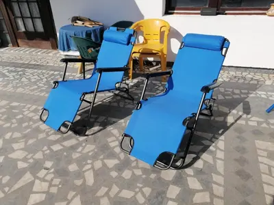 a group of chairs and a table on a patio at Vila Jovana A in Rogljevo