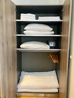 a closet with white pillows in it at Apartman 20, Brzeće Centar in Brzeće