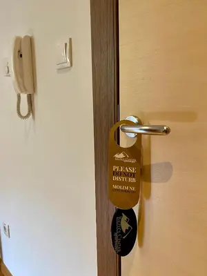 a wooden door with a key tag on it at Apartman 20, Brzeće Centar in Brzeće