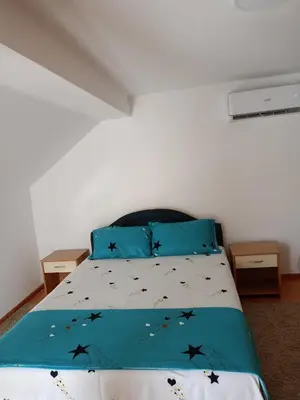 a bedroom with a bed with black bats on it at Gostinska kuća in Leskovac