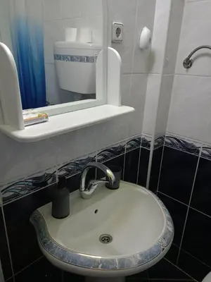 a bathroom with a sink and a mirror at Gostinska kuća in Leskovac