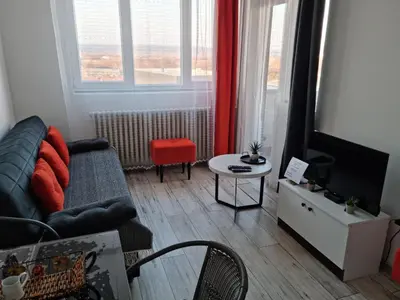 a living room with a couch and a tv at CENTRAL in Kruševac