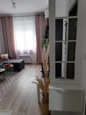 a living room with a couch and a table at apartman TARA aqua park in Jagodina