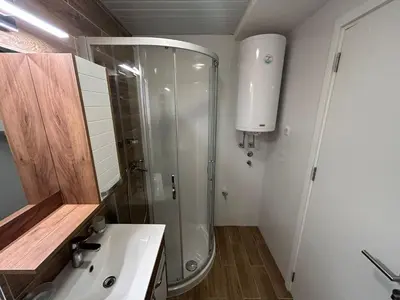 a bathroom with a shower and a sink at Centar Crnjanski 1 in Jagodina