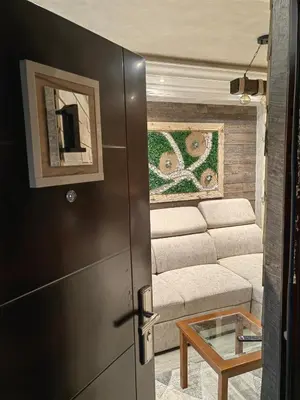 a living room with a refrigerator and a couch at Premium Urban Life in Zaječar