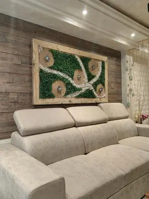 a couch in a room with a wall with a painting at Premium Urban Life in Zaječar