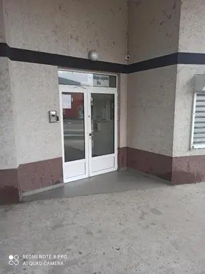 a door on the side of a building at Mila lux in Niš