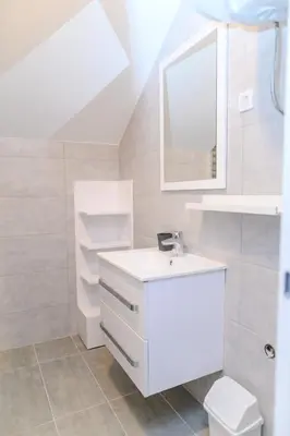 a white bathroom with a sink and a toilet at AQUA LUX - Green Hill - Kod akva parka Podina in Soko Banja