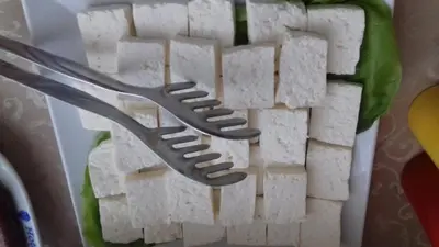 a fork sitting on top of a plate of food at Garni Hotel Crystal Ice in Niš