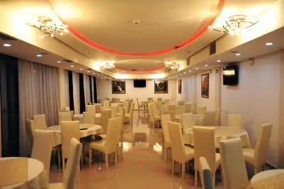 a conference room with tables and chairs in it at Garni Hotel Crystal Ice in Niš