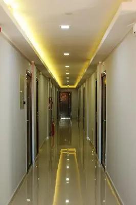 a hallway of a building with a long corridor at Garni Hotel Crystal Ice in Niš