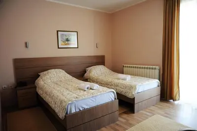 a bedroom with two beds in a room at Garni Hotel Crystal Ice in Niš