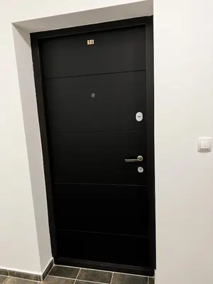 a black door with the number eight on it at A1 Miladinovic in Kraljevo