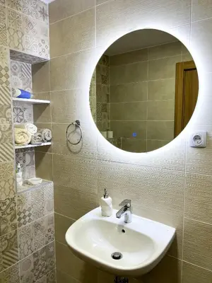 a bathroom with a sink and a mirror at A1 Miladinovic in Kraljevo