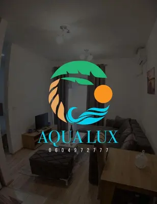 a room with a sign that says aquarius at Aqua Lux Apartman in Jagodina
