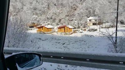 a view from a car window of a snow covered house at Milica 2 Mezdrejska 87 A in Crni Vrh