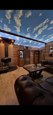 a living room with a couch and a table at Magareće Mleko Eko Farma Sisevac Wellness&Spa in Paraćin