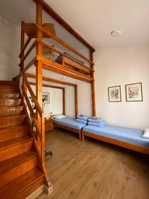 a living room with a bunk bed and stairs at Rustic Villa in Jagodina