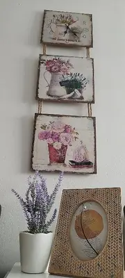 a group of plates and a vase on a shelf at Queen Apartmančić in Zaječar