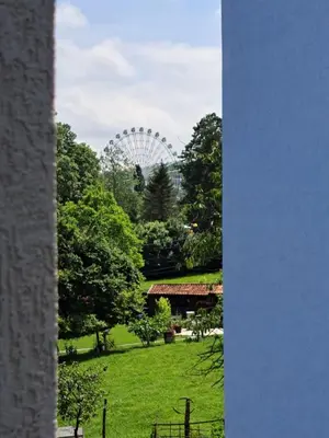 a view of a ferris wheel in a park at Apartman Imperator Vrnjačka Banja in Vrnjačka Banja
