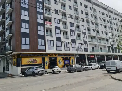 a large building with cars parked in front of it at RELAX LUX AKVA PARK 2(K-KOMPLEX) in Jagodina