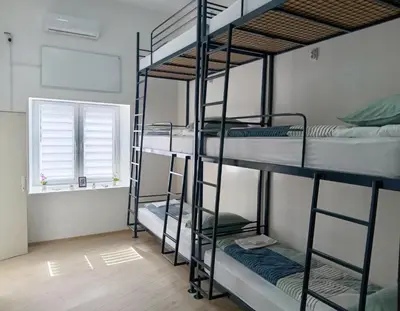 a room with four bunk beds and a window at Жути Ранац - Žuti Ranac - Yellow Backpack in Boljevac