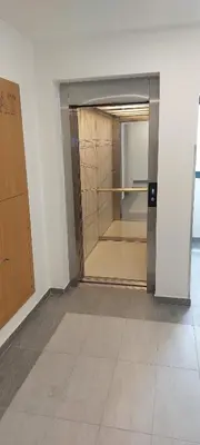 an empty room with an open door in a building at Centar Crnjanski in Jagodina