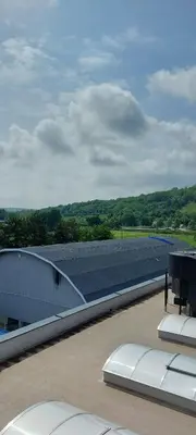 a view of a building with a table on the roof at Centar Crnjanski in Jagodina