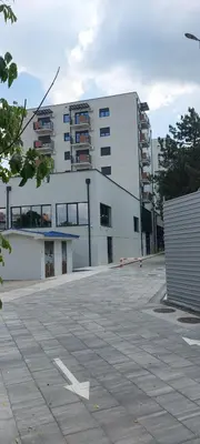an empty parking lot in front of a building at Centar Crnjanski in Jagodina