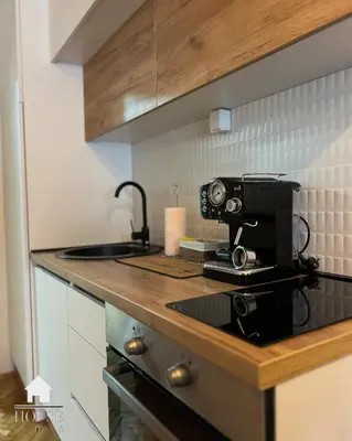 a kitchen with a coffee maker on a counter at House Inn in Pirot